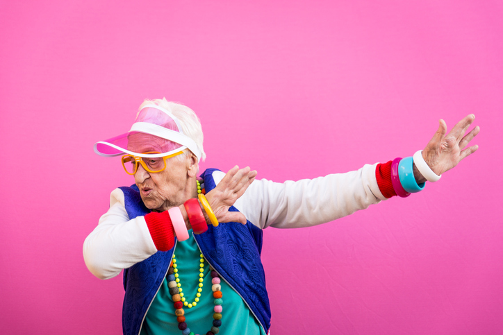 Funny grandmother portraits. 80s style outfit. trapstar taking a selfie on colored backgrounds. Concept about seniority and old people
